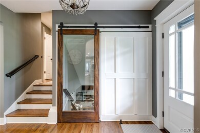 Pretty entry with cool glass barn door