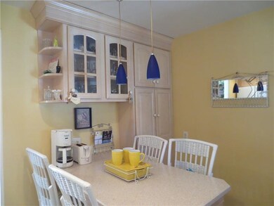 Beautiful kitchen features built-in table with cha