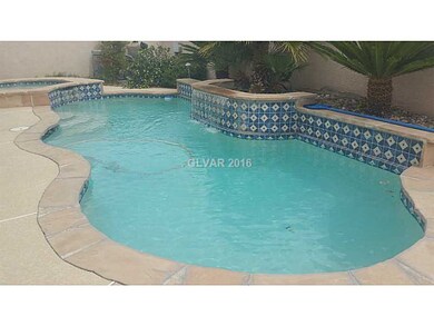 Property Photo. Pool with waterfall