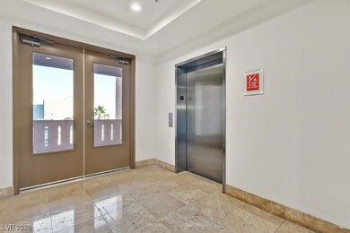 Entryway featuring elevator and french doors