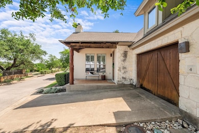 View of exterior entry featuring stone siding, a 