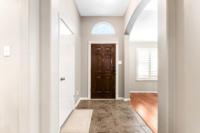 As you enter the front door, to the right is a cozy den with views of the front yard, while to the left, you’ll find the spacious two-car garage.