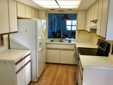 Kitchen showing new faucet, dishwasher and range.