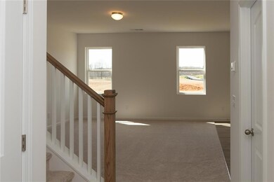 Stairway featuring carpet floors, baseboards, and 