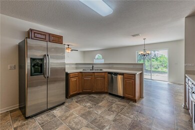 Huge Kitchen with View of Dinette.