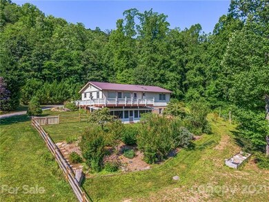 Check out the fully fenced yard with gorgeous landscaping and raised beds.