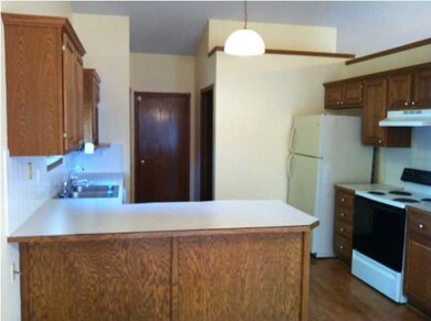 Kitchen with Wood Floors and Eating Bar