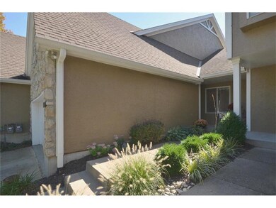 Beautiful maintained landscaping taking you to fro