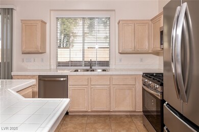 Kitchen featuring appliances with stainless steel