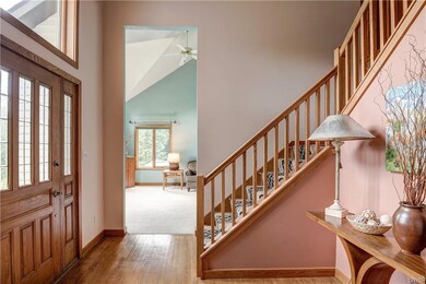 Walk thru the beautiful front door to a two story foyer which has a oak banister and hardwood floors.