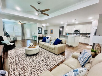 Living room featuring ornamental molding, ceiling 