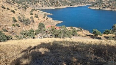 View of neighbor's house and lake from the top of the lot.