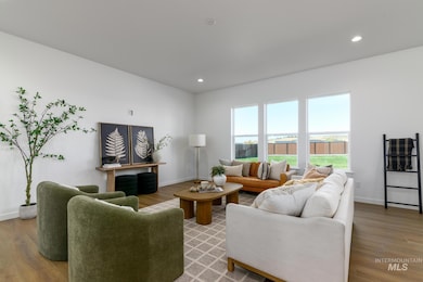 Living room with wood finished floors and recessed lighting