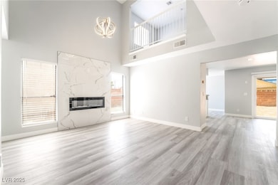 Unfurnished living room featuring a high end firep