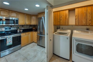 Full size washer and dryer in closet with more cab