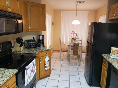 Oak Cabinets/Black Appliances