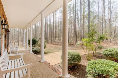Deep covered front porch showing the buffer of woo