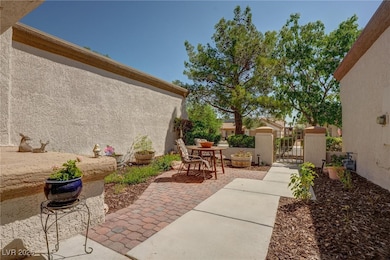 View of patio featuring a gate