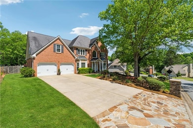 Traditional-style home with a front lawn, driveway