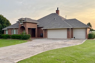 View of front of house featuring roof with shingles, an attached garage, brick siding, and concrete driveway