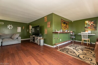 Living room with hardwood / wood-style flooring