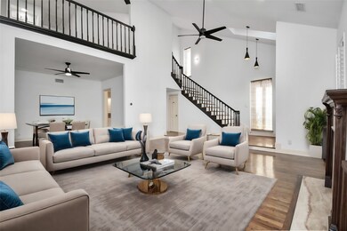 Revel in the fusion of style and functionality with exquisite wood flooring throughout the house, creating an ambiance of understated elegance. Note the open concept floor plan allowing for ease of flow from living to dining