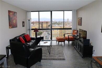 Living room with floor to ceiling windows and view