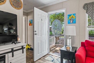 Entrance foyer featuring ornamental molding and li