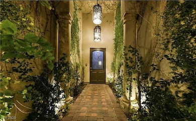 Property entrance featuring stucco siding