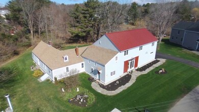 The aerial photo shows the original home with its 