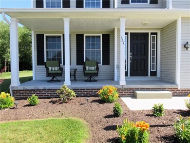 Enjoy the perfectly landscaped front lawn from the