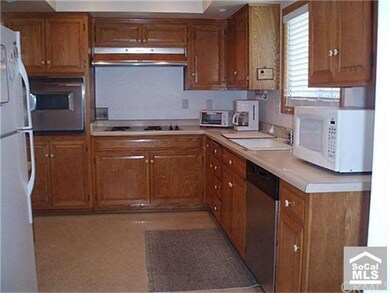 Kitchen connects to  separate laundry and side yar