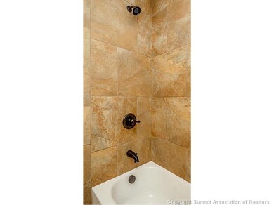 Bathroom. Guest Bathroom with full tile surround a