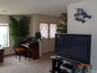 Entrance in living room, carpet.