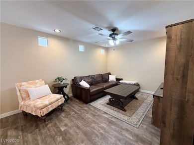 Living room featuring wood finished floors, ceilin