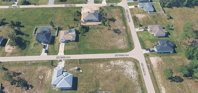 Aerial view of property's location featuring nearby suburban area