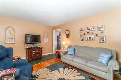Living area boasts Hardwood Flloors