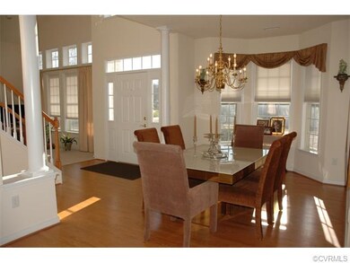 Another view of dining room with columns separatin
