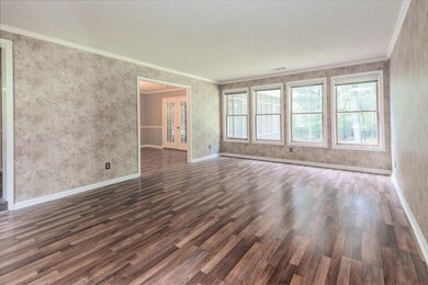Many windows overlook rear acreage.