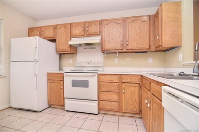 Kitchen offers plenty of cabinets for storage and 