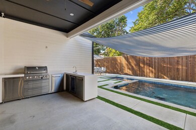 Covered back patio and outdoor kitchen
