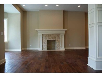 Other. The fireplace is surrounded in tumbled ston