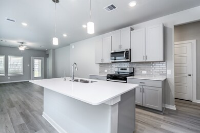 Modern kitchen with white granite countertops and