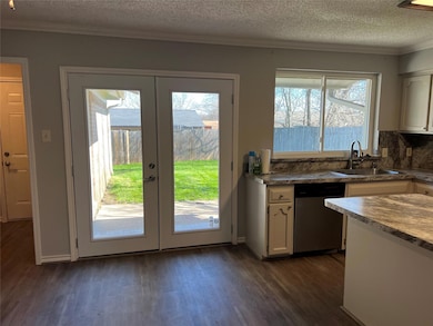 Kitchen with newly installed exterior window and doors - View