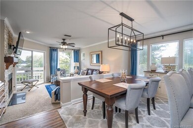 Dining area over looking Living Room ~ Side windows makes the unit  feel much larger then the interior units!