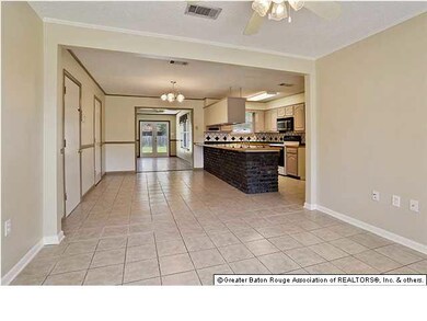 Open living to kitchen. Extra large utility room o