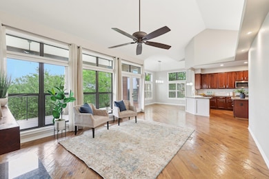 Living area with baseboards, a ceiling fan, high 
