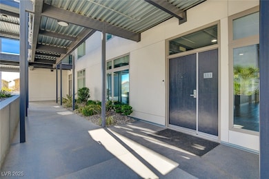 View of exterior entry featuring stucco siding