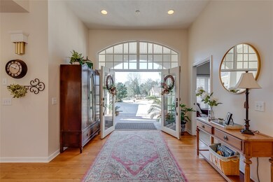 The beautiful front door allow lots of natural lig