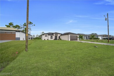 View of front of home with concrete driveway, a fr